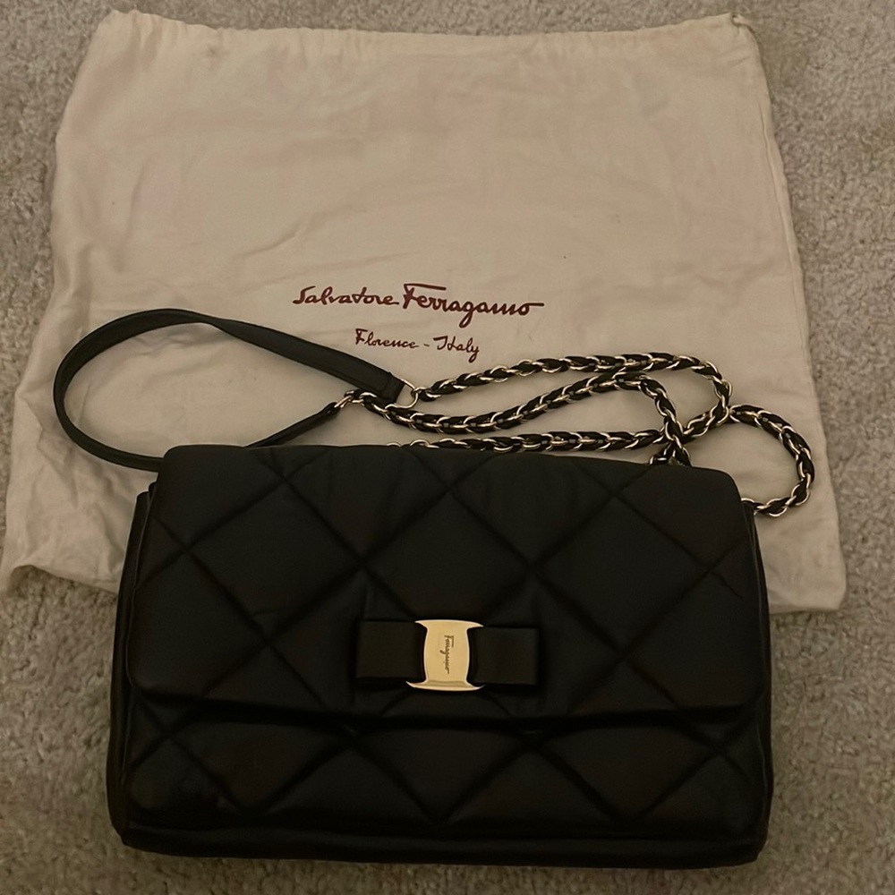 Salvatore Ferragamo black lamb skin with gold hardware crossbody/clutch bag.